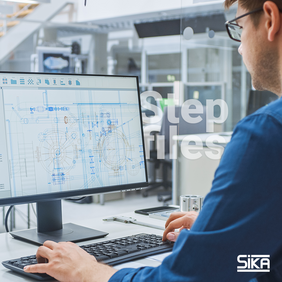 News-step files; Man in lab looking at files on computer